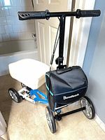 Full view of BlessReach knee scooter showing frame, wheels, bag, handlebar