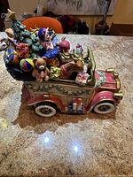 Left side view of Fitz and Floyd Santa Car Cookie Jar