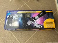 Front of Meade 70 mm Land & Sky Telescope retail box showing product image and specs