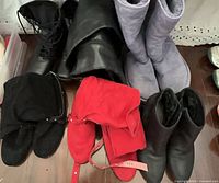 All four pairs of boots arranged together showing styles and colours