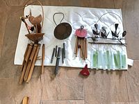 All four wind chimes laid out showing full lengths and materials