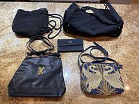 Group shot of all five bags on countertop