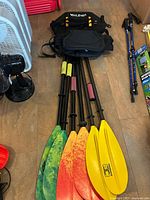 Overview of paddles and seats on floor