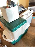 Stacked plastic totes with fabric cube on top