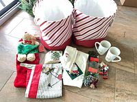 All items overview: fabric baskets, mugs, stockings, linens, ornaments, picks, napkins
