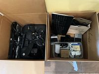 Two boxes with printer/scanner, Blu-ray players, cables
