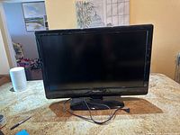 Front view of Philips 32-inch LCD TV on stand
