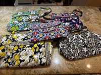 All five Vera Bradley quilted cotton bags displayed together