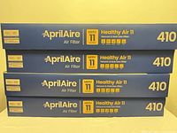 Stack of four Aprilaire 410 air filter boxes front view