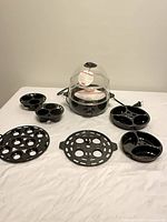 Egg cooker with all trays displayed