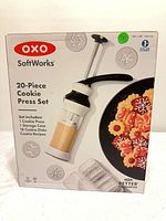 Front of boxed OXO SoftWorks 20-Piece Cookie Press Set