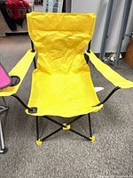 Yellow folding camping chair front view