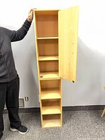 Full view of one book tower section with door open showing shelves