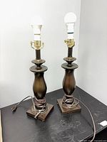 Two Stiffel lamps without shades showing bodies and cords