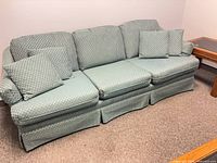 Front view of sofa with pillows and cushions in place