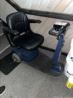 Full view of scooter showing seat, platform, rear wheel