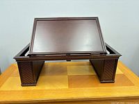 Bed tray front view showing flat tabletop and wicker side panels