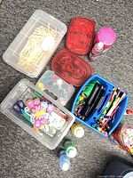 Overhead view of entire lot showing bins, caddy, paint bottles, watercolour palette and craft sticks