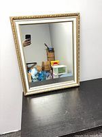 Front view of framed mirror on table