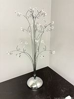 Full view of chrome and glass jewelry tree stand