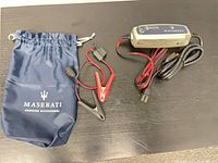 Charger, clamp lead and pouch overview