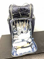 Backpack opened showing all sealed components