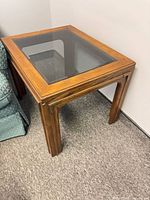 Full view of side table showing glass top and wood frame