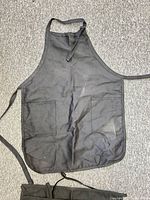 Black bib apron with two front pockets