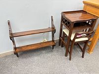 Wall shelf and telephone table with chair for scale
