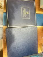 Blue faux-leather binder and slipcase closed