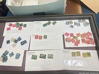 Overview of several cards displaying mixed U.S. used stamps