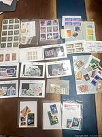 Overview of multiple sleeves containing assorted Canadian mint stamps