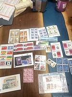 Full layout of assorted mint Canadian stamps, plate blocks and souvenir sheet