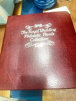 Front cover of red binder showing collection title