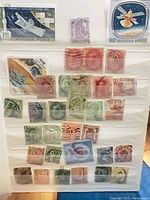 album page with Hungarian 150 Ft satellite stamp and multiple smaller definitives