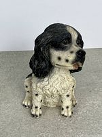Front view of black and white English Cocker Spaniel figurine