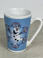Front view of tall Olaf coffee mug