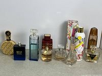 Front view of eleven assorted fragrance items lined up