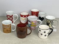 Group shot of all nine novelty mugs