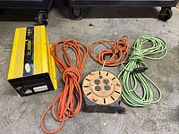 Inverter, extension cords and cord reel grouped
