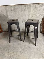 Front view of both metal bar stools