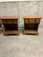 Front view of both night stands showing drawers, shelves, bases