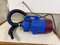 Side view of Double K ChallengAir dryer with hose and cord