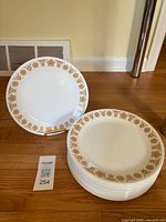 Stack of plates and one displayed upright showing pattern