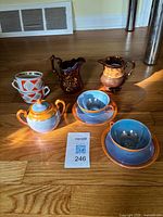 All nine lusterware pieces grouped