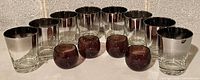 Group of eight silver ombre tumblers and five amethyst roly poly glasses