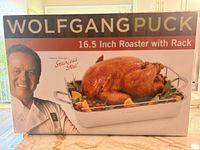 Front of box showing Wolfgang Puck 16.5" Roaster with Rack image