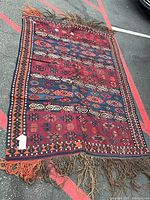 Full view of rug showing overall design, size and condition