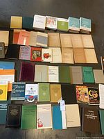 Full lot overview showing roughly 40-60 books in rows