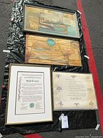 Overall view of the four framed pieces on tarp